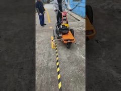 What are the advantages of using a road machine with a battery charger compared to one without?